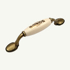 Puxador Alça Porcelana Marfim com Estampa Dourada e Base Metal 96mm - C1464