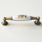 Puxador Metal Bronze Antigo e Porcelana Branca Floral 96mm - C1549
