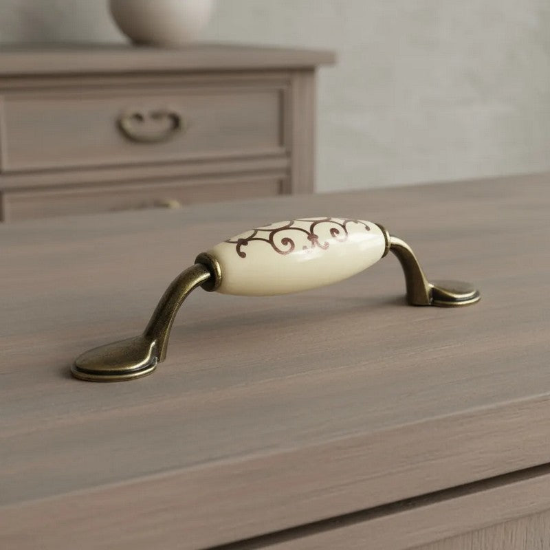 Puxador Metal e Porcelana Marfim Des Dourado 96mm - C1574
